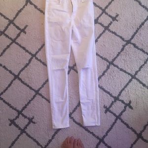 white high waisted jeans with rips on knees